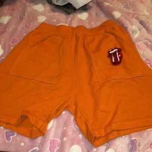 Orange fashion over biker shorts